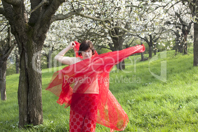 Woman with red cloth with cherry blossom