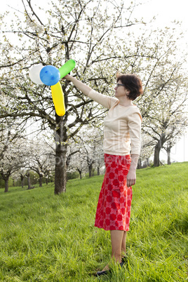 Woman with balloons at the Cherry Blossom