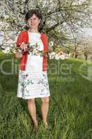 Woman is recovering under blooming cherry tree old