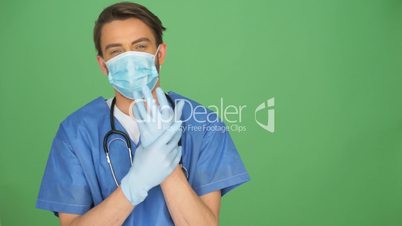 Anaesthetist or doctor taking off the mask