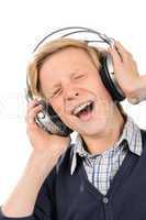 Cheerful teenage boy enjoy music from headphones