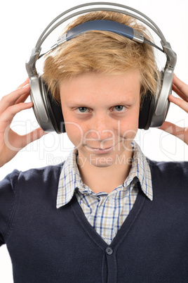 Confident teenage boy listening to music