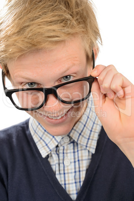 Cheerful nerd boy looking above geek glasses