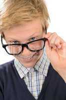 Cheerful nerd boy looking above geek glasses