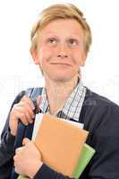 Thoughtful teenage boy holding books