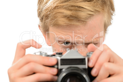 Boy photographing with retro camera