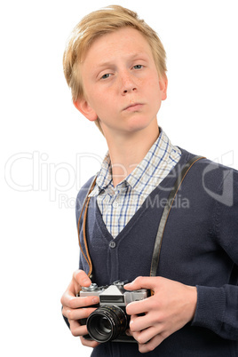 Confident teenage boy with retro camera