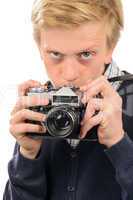 suspicious boy photographing through retro camera
