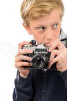 suspicious teenage boy holding retro camera