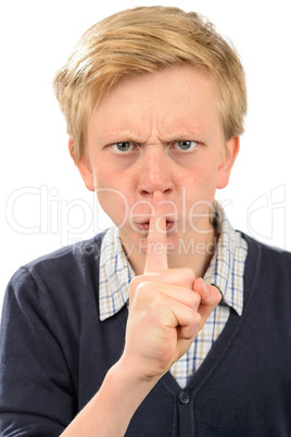 Angry boy with finger on lips