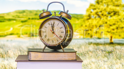 Clock and Bible front of monitor