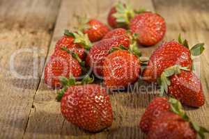 close up of strawberries on wood