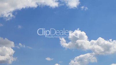 Time lapse of  clouds over blue sky