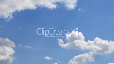 Time lapse of  clouds over blue sky