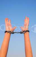 Handcuffed woman hands