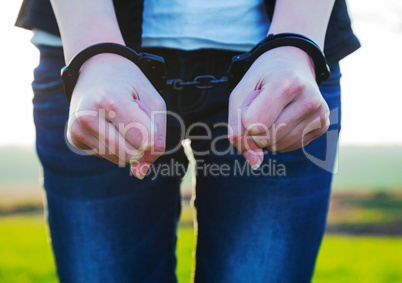 Woman with handcuffed hands