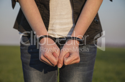Handcuffed woman's hands