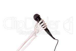 skeleton hand holding microphone