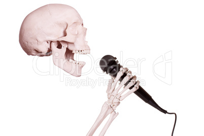 skeleton hand holding microphone