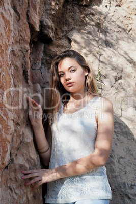 Portrait of a girl against against the rock