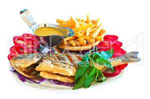 Fried carp with vegetables, chips and sauce
