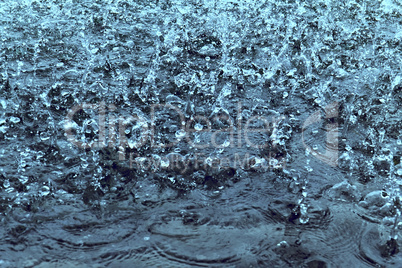 raindrops on water as background