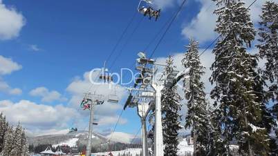 Ski Lifts Moving Over Trees