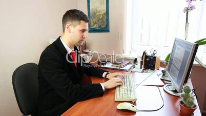 Man Typing Some Documents