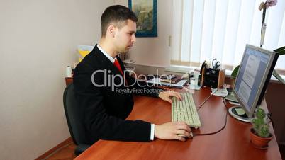 Man Typing Documents At Work