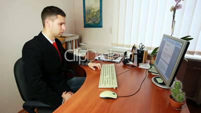 Man Talking On Phone At Work