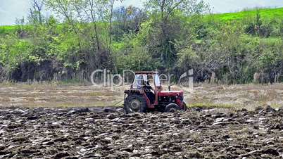 tractor is plotting agriculture field for seeding