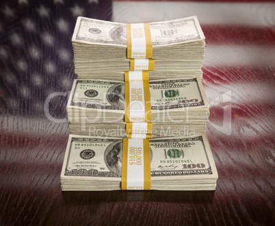 Thousands of Dollars with Reflection of American Flag on Table
