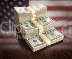Thousands of Dollars with Reflection of American Flag on Table