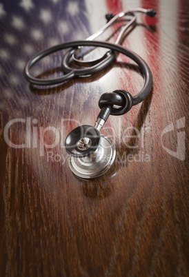 Knotted Stethoscope with American Flag Reflection on Table