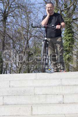 Cyclist is riding his bike on the stairs