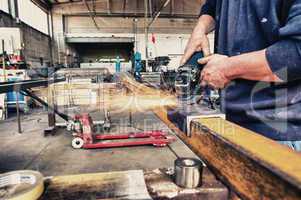 Man working with grindstone in a factory