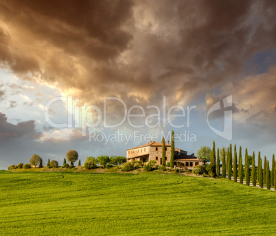 Countryside of Tuscany in spring season. Green fields and dramat