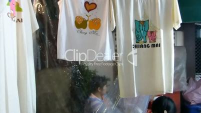 Stall selling printed t-shirts at night bazaar, Chiang Mai, Thailand