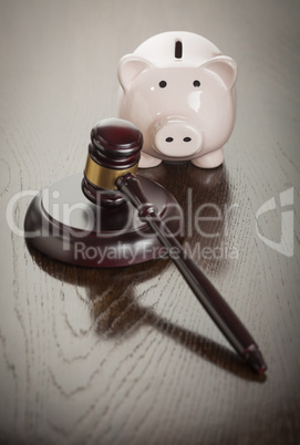 Gavel and Piggy Bank on Table