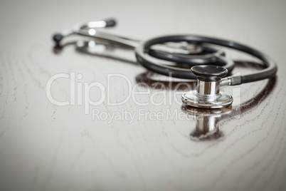 Doctor Stethoscope Laying on a Reflective Table