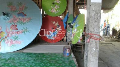 Drying handpainted umbrellas at Bo Sang Handicraft Centre, Chiang Mai.(CM--100a)