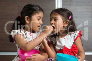 sibling sharing food