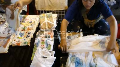 Stalls selling printed t-shirts & guitars at night bazaar, Chiang Mai, Thailand