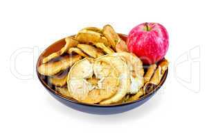 Apple fresh red and slices of dried in bowl