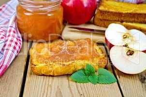 Bread with apple jam and apples on board
