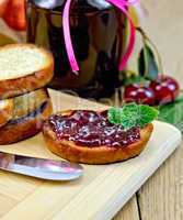 Bread with cherry jam on a board