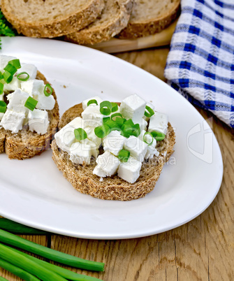 Bread with feta and chives on a plate