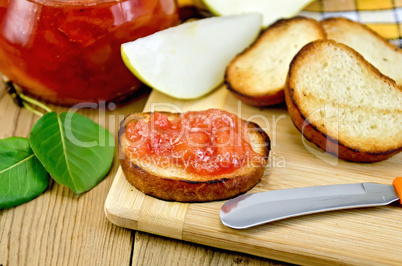Bread with pear jam on a board