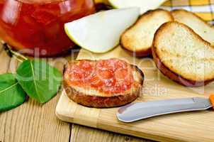 Bread with pear jam on a board