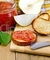 Bread with pear jam and leaf on board